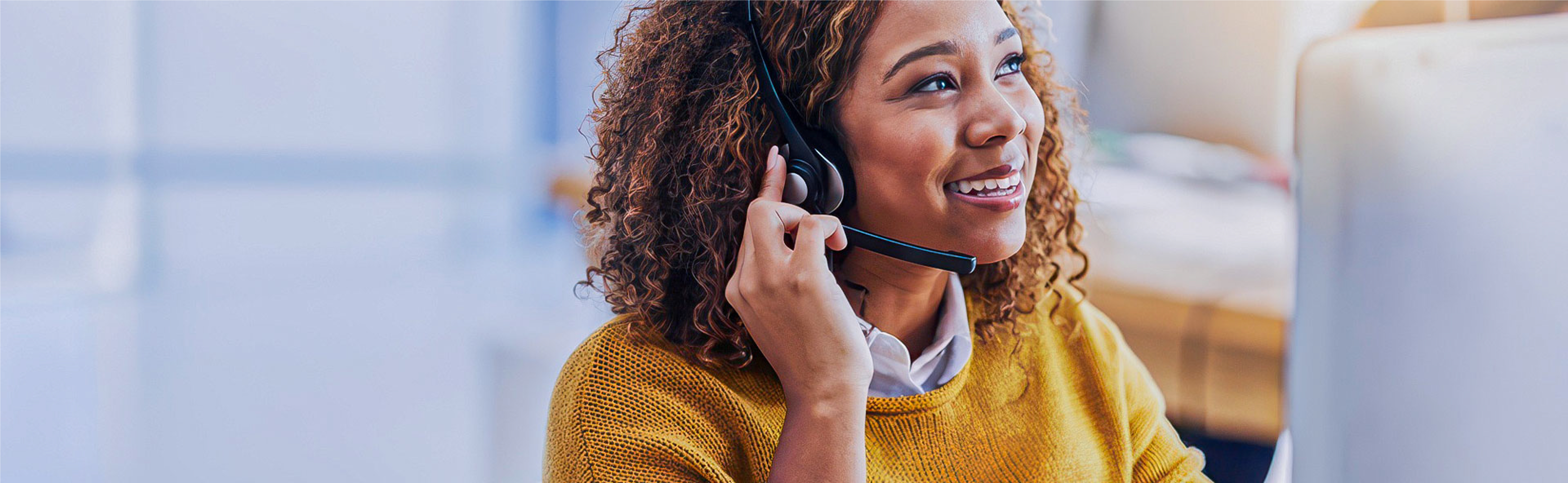 Customer support agent talking on headset